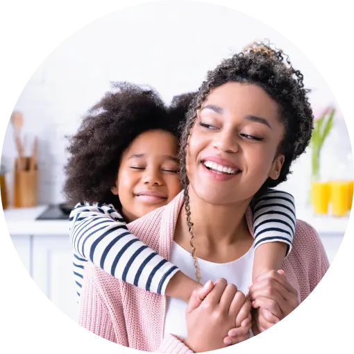 Image of a woman and her child smiling