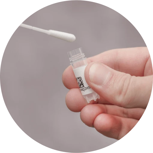 Hand holding a whole genome sequencing vial while a sample is being inserted.